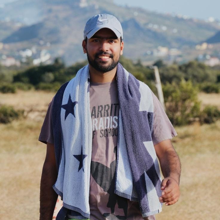 Avery Singh, Lead Design Curator at Novaletri Sphera, reviewing corporate floral arrangements